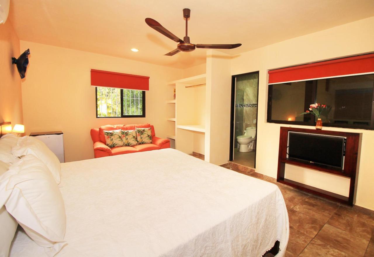 Papagayo Hotel Boutique Playa del Carmen Buitenkant foto A bedroom at the hotel