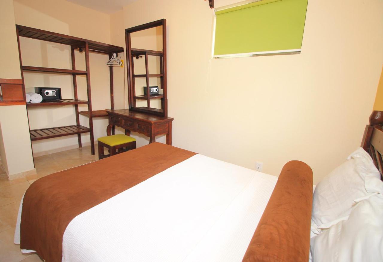 Papagayo Hotel Boutique Playa del Carmen Buitenkant foto A bedroom at the hotel